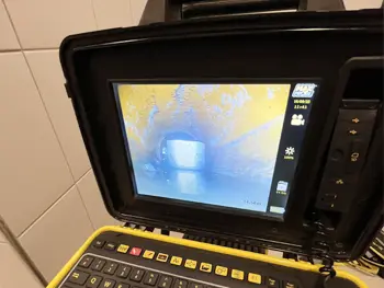 Unexpected Find: CCTV Drain Survey reveals a metal mug stuck in the drain. How did this end up here?