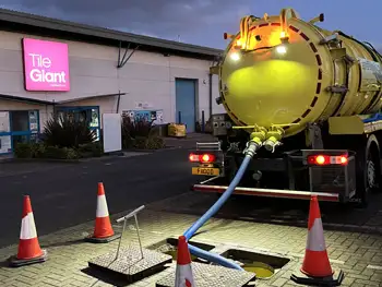 Jet and Drain's powerful vacuum tanker removing waste from a manhole at a business site in Bromley London