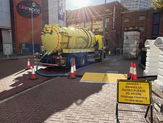 Jet and Drain vacuum tanker safely pumping drain waste from a Cineworld Cinema sewage pump station, providing fast and reliable service across London.