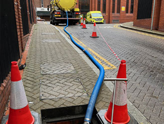 Jet and Drain vacuum tanker in operation, removing drain waste at a sewage pump station.