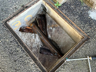 Manhole chamber cleared of debris and prepared for safe cover replacement.